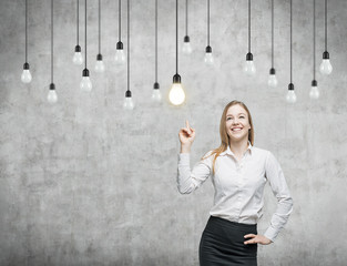  woman is pointing out the light bulbs. strategy. 