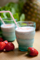 2 glasses with banana-strawberry smoothies 