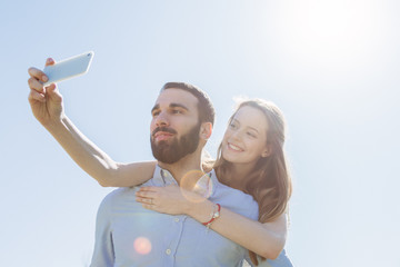 Selfie. A loving couple taking a photo at the park