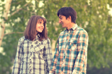 loving couple walking in a city park in spring