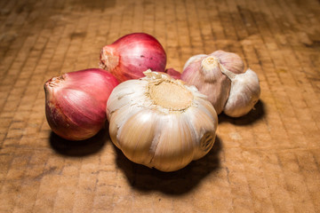 onion and garlic is spice of thai food on vintage background