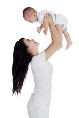 Mother and baby having fun in studio