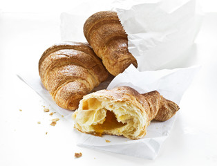 Fresh croissants on white background