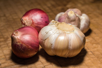 onion and garlic is spice of thai food on vintage background