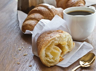 Fresh croissants with cup of coffee for breakfast.