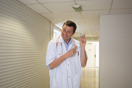 Handsome Doctor At Hospital Waiting For Patient