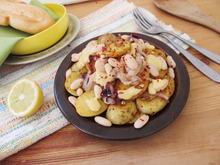 Fried potatoes with white beans.