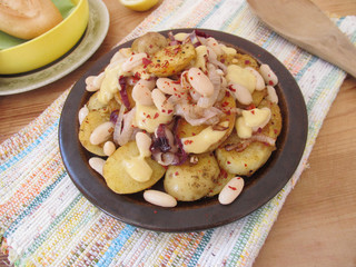 Fried potatoes with white beans.