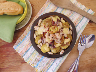 Fried potatoes with white beans.