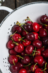 Fresh clean organic ripe cherries in colander