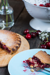 traditional homemade cherry pie served on rustic table