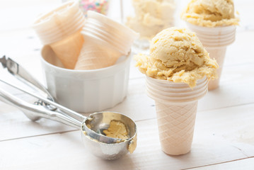 Homemade mango ice cream on vintage light white wooden