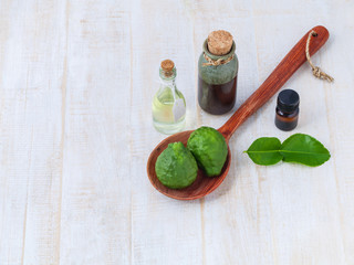 Fototapeta na wymiar Natural Spa Ingredients . - Kaffir lime essential oil for aroma