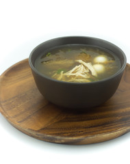 Fish maw soup on the wooden tray in white background (Thai food)