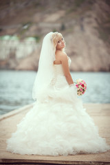 Fototapeta na wymiar И=Beautiful bride wedding day makeup hairstyle