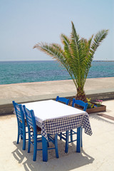 Traditional Greek table at the beach in Greece