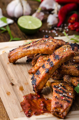 Grilled Spareribs in spicy marinade with beer and rustic bread