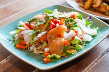Spicy salmon salad with mixed vegetable and herb