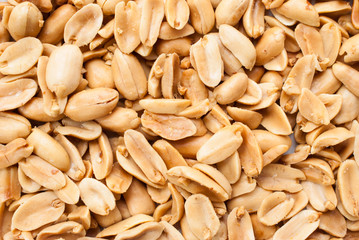 Peanuts. Close up of fried, peeled and salted peanuts on white