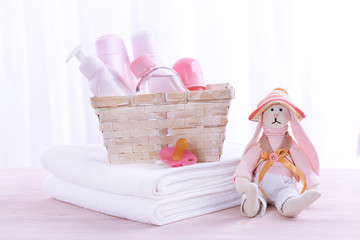 Baby accessories on table on light background