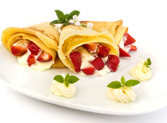 pancakes with strawberry, whipped cream and mint