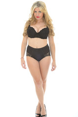 Naklejka premium Beautiful Sexy Young Woman Posing in Black Pin Up Lingerie