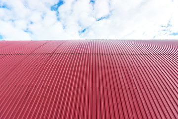 Rooftop of curved red corrugated iron