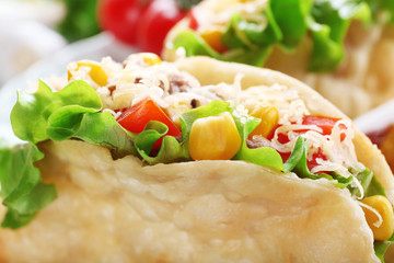 Tasty taco on plate close up
