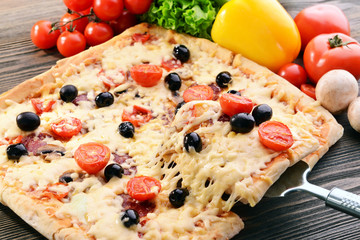 Delicious homemade pizza on table close-up