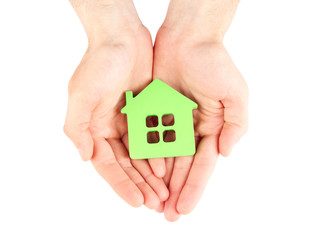Female hands holding house isolated on white