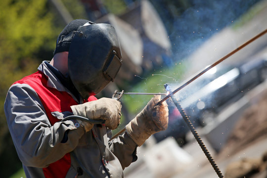 Construction Worker Welder Welding Steel Rod Rebar Outdoors