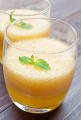 pineapple juice and pineapple on wood table. for health