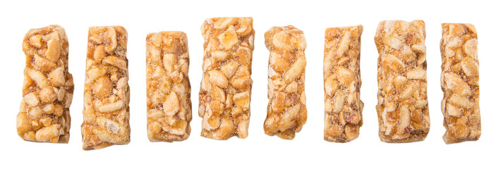 Caramelized candy nuts over white background 