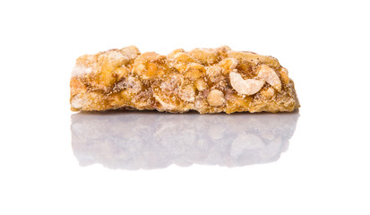 Caramelized candy nuts over white background 