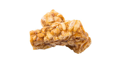 Caramelized candy nuts over white background 