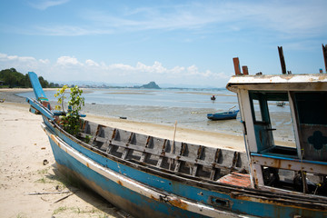 Broken fisherman boats on the coast
