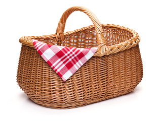 Wicker picnic basket with red checked napkin. - Powered by Adobe