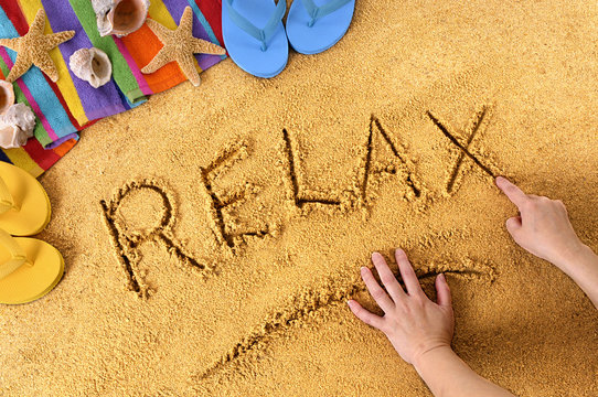 Relax beach writing word written in sand summer vacation relaxing holiday photo