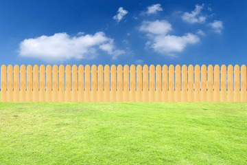 Fence on grass and sky background