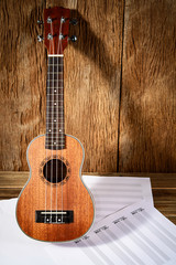 Ukulele and musical paper notes