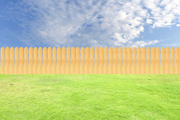 Fence on grass and sky background