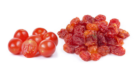 dried tomato and red cherry tomatoes on white background