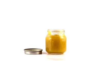 Jars of baby fruit puree with the lid open