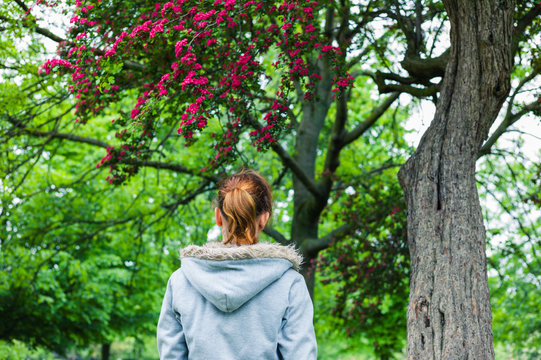 Young woman walking in park