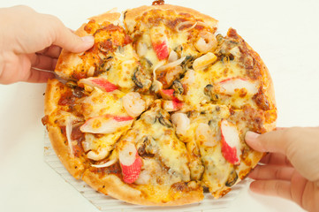 Pizza in hand in white background