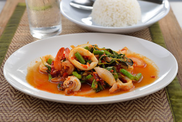 stir fried squid with chilli and basil isolated on white
