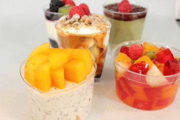  Different colorful dessert in small glass.