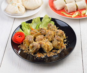 Dumplings  for appetizer on black plate