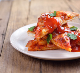 Hawaiian pizza With tomato sauce and mint leaves