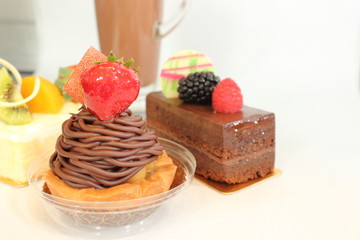  different fruit  decorated pastries  cakes and slices of cakes.